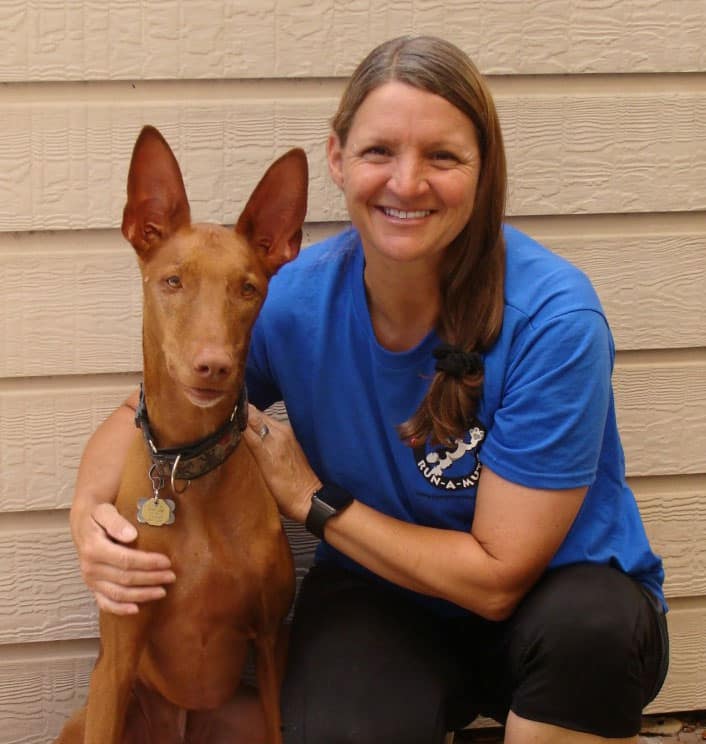 Susan Dorsey smiling with dog